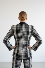 Zwart-witte tweed blazer achterkant volledig